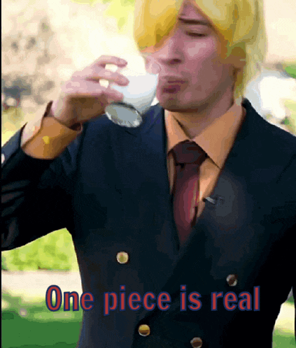 a man in a suit and tie drinking a glass of milk with the words one piece is real written on the bottom