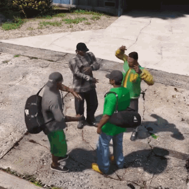 a group of men are standing on a sidewalk and one of them is wearing a green jacket with the letter m on it