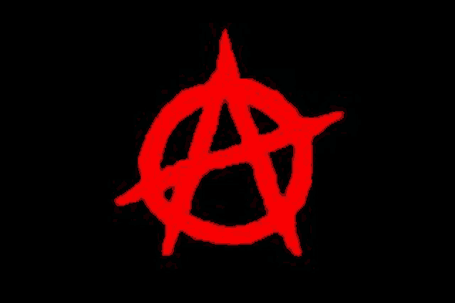 a red anarchy symbol on a black background .