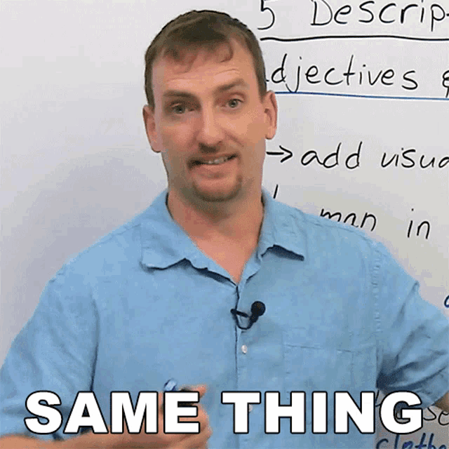 a man in a blue shirt stands in front of a whiteboard with the words same thing written on it