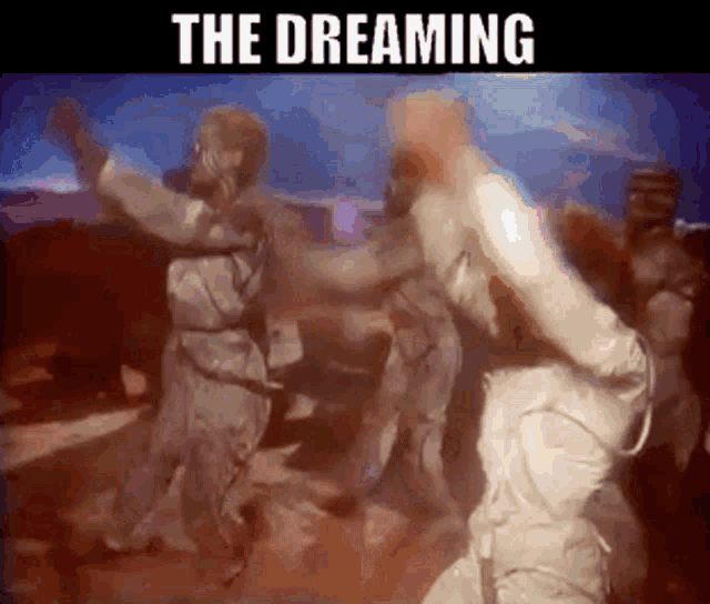 a group of people are dancing in a dark room with the words " the dreaming " above them