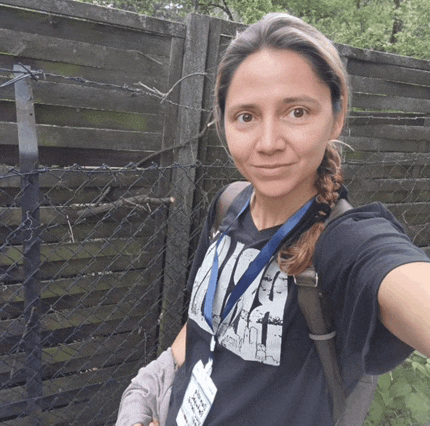 a woman wearing a lanyard with a name tag that says ' a.f.c.t. ' on it