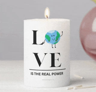 a candle that says " love is the real power "