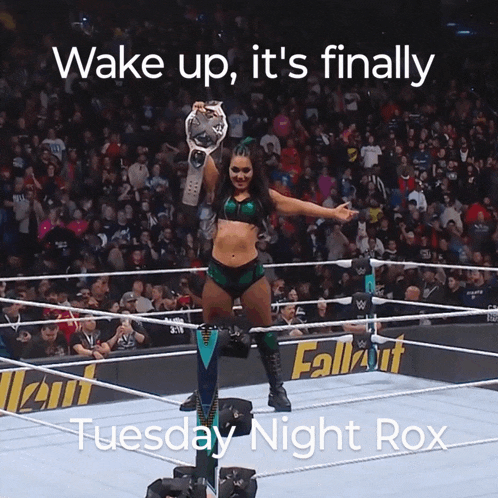 a woman in a wrestling ring with the words wake up it 's finally tuesday night rox above her