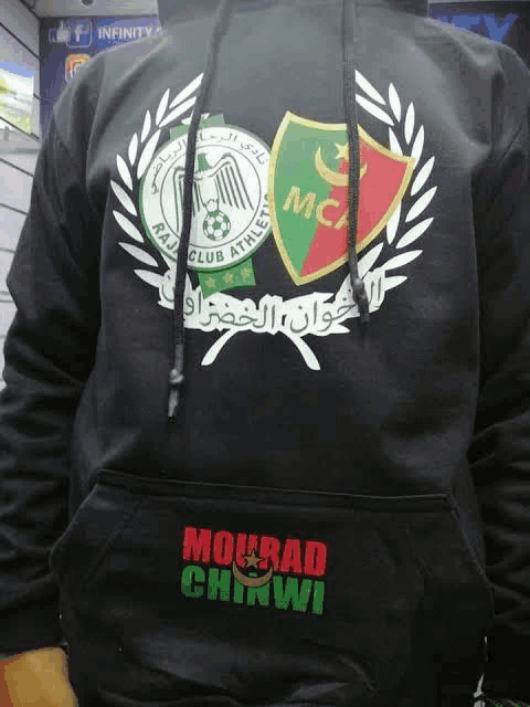 a person wearing a black hoodie that says mourad chinwi on the front