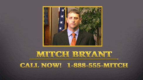 a man in a suit and tie with the name mitch bryant