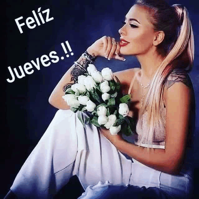 a woman is sitting down holding a bouquet of white roses and the words feliz jueves are above her