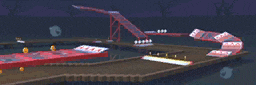 a blurred image of a roller coaster track with a sign that says ' a ' on it