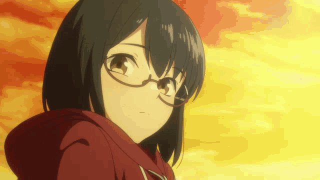 a girl with glasses and a red hoodie