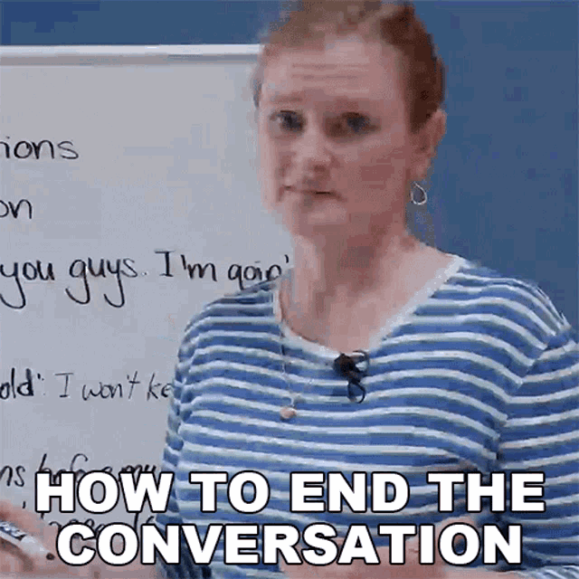 a woman in a blue and white striped shirt stands in front of a white board that says how to end the conversation