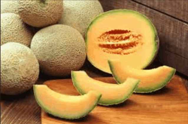 slices of cantaloupe are on a cutting board