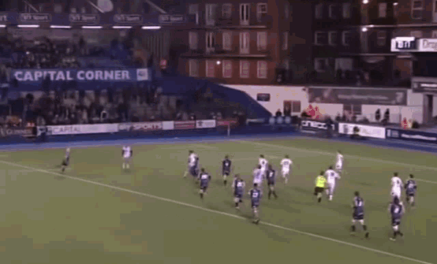 a group of soccer players are running on a field with a banner that says ' continental ' on it .