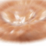 a close up of a donut with a white icing on a white background .