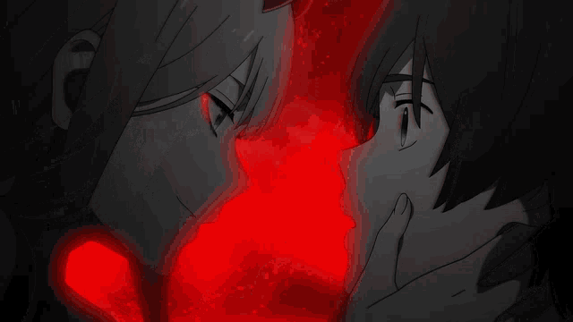 a man and a woman are looking at each other with a red background behind them