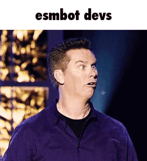 a man in a purple shirt is making a funny face with the words esmbot devs above him