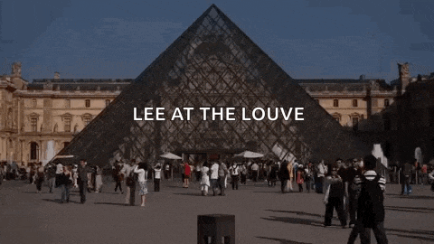 a crowd of people are gathered in front of a pyramid with the words lee at the louvre written on it