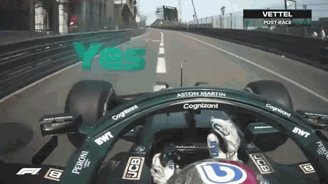 a man is driving a race car on a track and the word yes is on the bottom