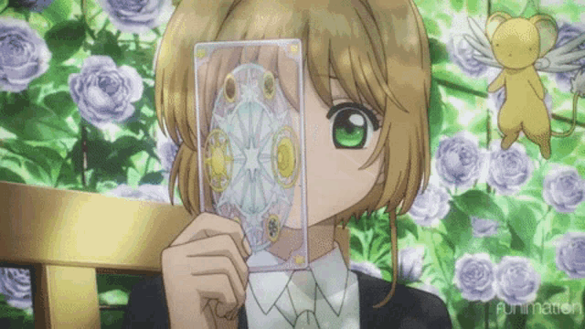 a girl is holding a tarot card in front of her face and the word funimation is on the bottom