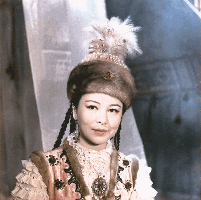 a woman wearing a fur hat with a feather on it