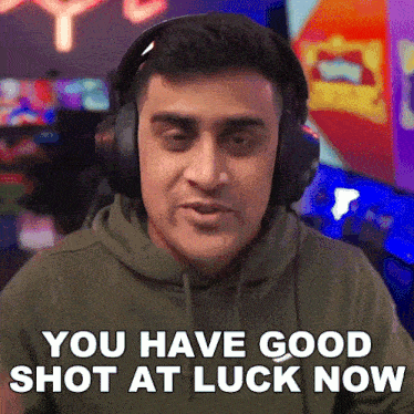 a man wearing headphones and a hoodie says you have good shot at luck now