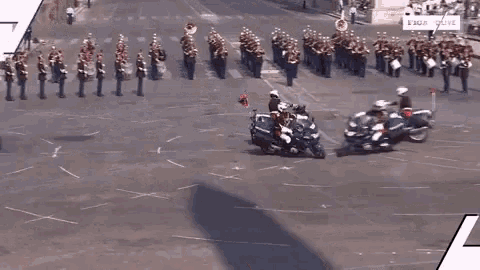 a group of police officers are riding motorcycles in a parade with the words " do n't mess " written in red