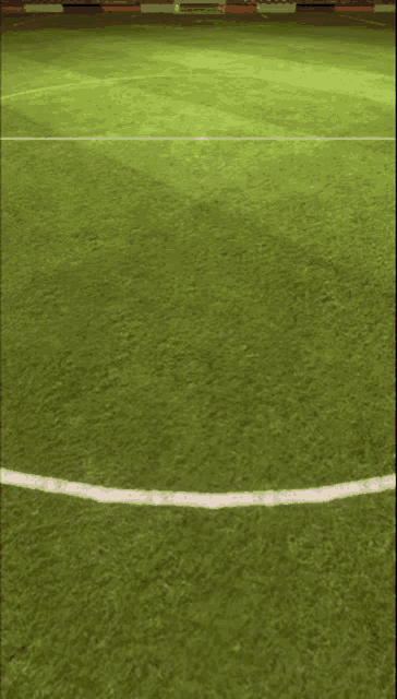 a soccer field with a white line going through it