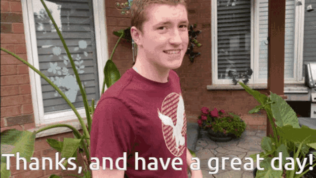 a young man in a maroon shirt stands in front of a brick building with the words thanks and have a great day