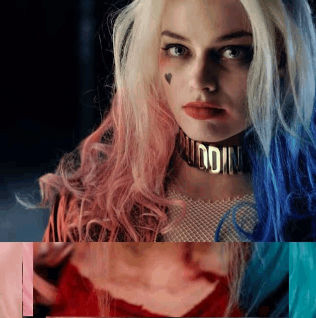 a woman with pink and blue hair wearing a choker that says ' suicide squad ' on it