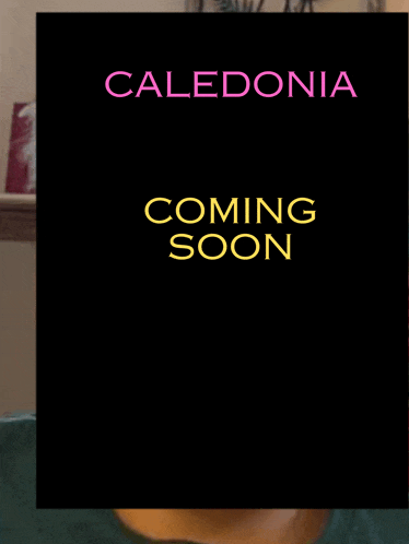 a black poster with caledonia coming soon in yellow letters