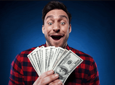 a man in a plaid shirt holds a bunch of money