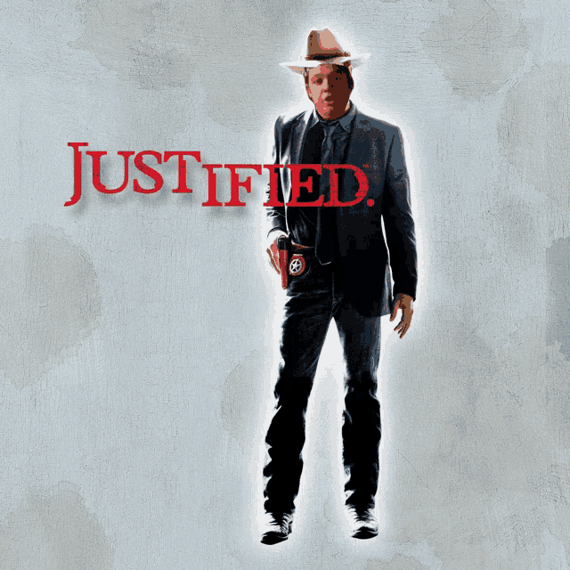 a man in a suit and cowboy hat is standing in front of a wall that says justified