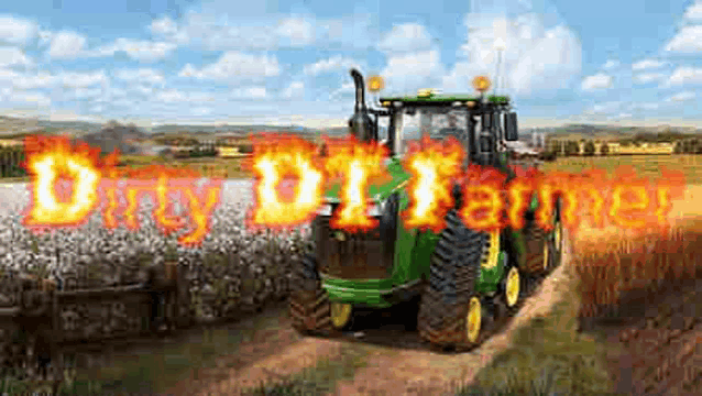 a john deere tractor is driving through a field of cotton