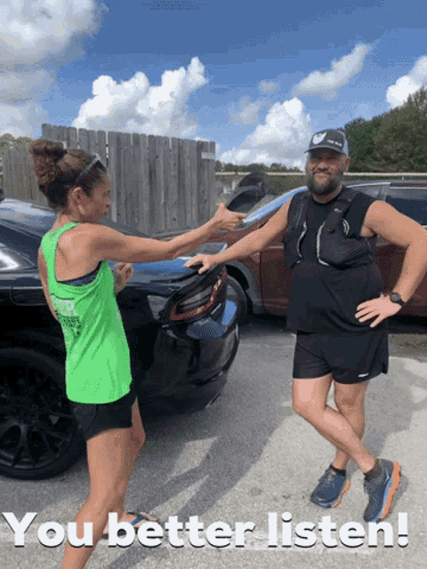 a man and a woman are standing in front of a car with the words " you better listen " on the bottom