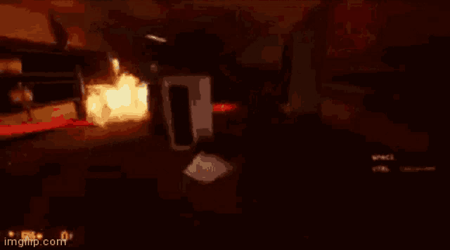 a video game is being played in a dark room with a fire coming out of a doorway .