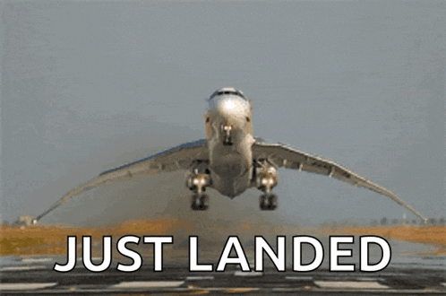 an airplane is taking off from a runway and the words just landed are below it