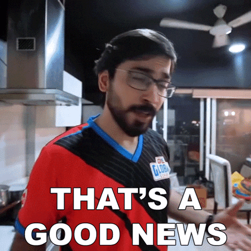 a man with glasses and a beard says that 's a good news in a kitchen