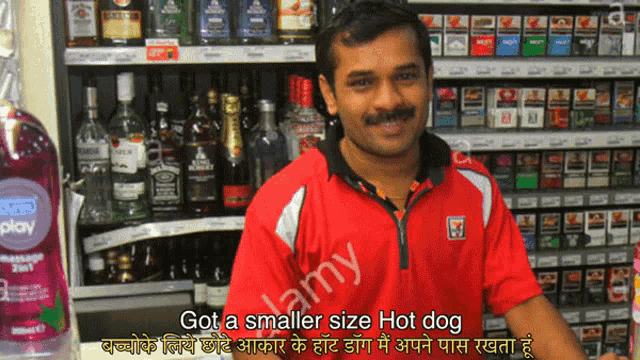 a man standing in front of a shelf of liquor and cigarettes with a caption that says got a smaller size hot dog