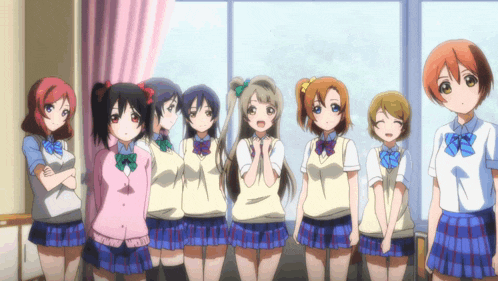 a group of anime girls standing next to each other in front of a window