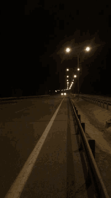 a dark highway with a lot of lights on