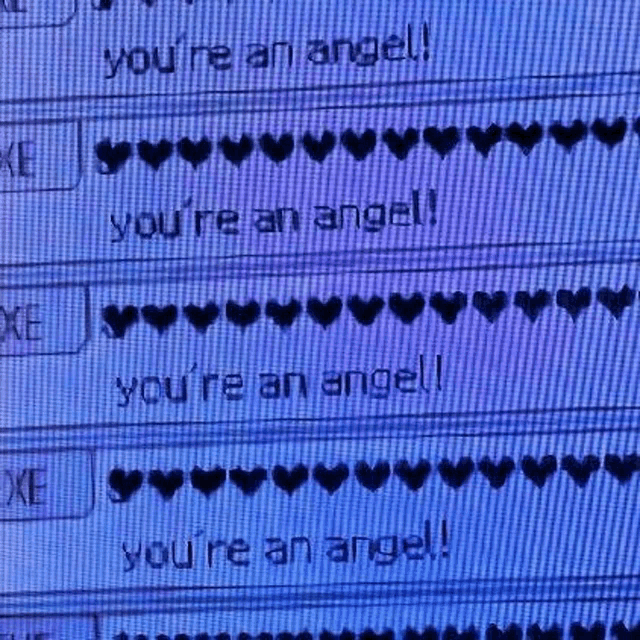 a computer screen with a message that says `` you 're an angel '' and hearts on it .