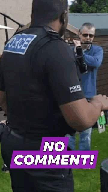 a police officer stands in front of a man playing a flute and says no comment