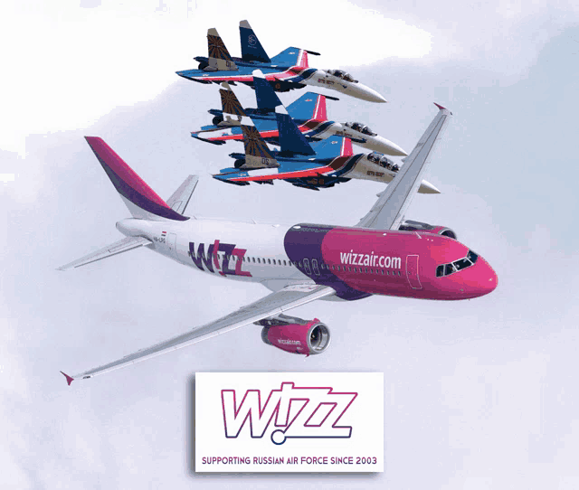 a wizz airplane is flying in the sky with fighter jets in the background