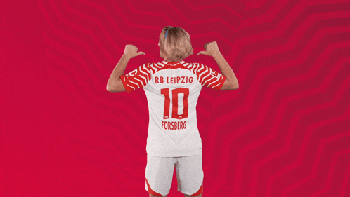 a woman is wearing a rb leipzig jersey with the number 10 on it