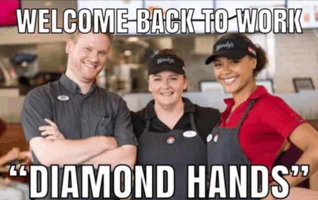 a group of wendy 's employees are posing for a picture