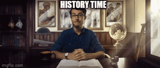 a man is sitting at a desk with a book and a sign that says " history time " above him