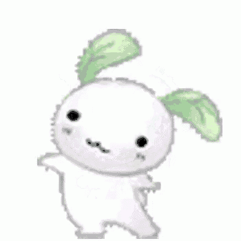 a white rabbit with green ears and leaves on its head is dancing .