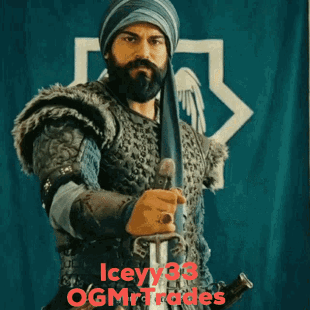 a man with a beard is holding a sword in front of a flag that says ogmrtrades