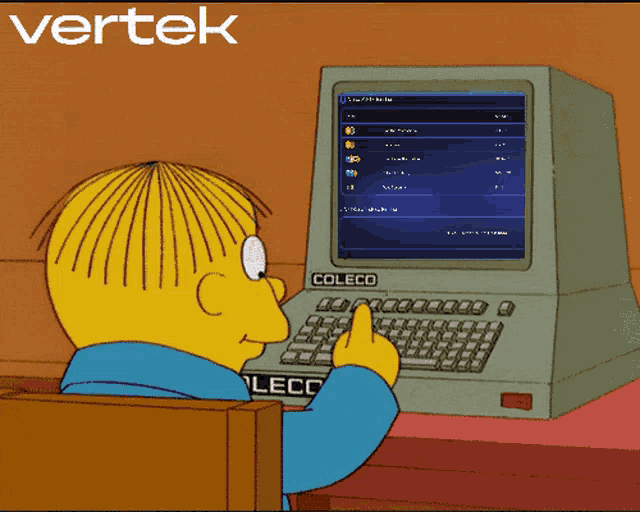 a cartoon character sitting in front of a coleco computer with the word refresh below him