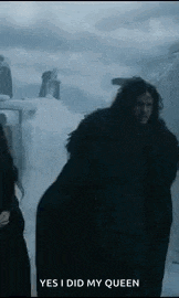 jon snow from game of thrones is walking in the snow .