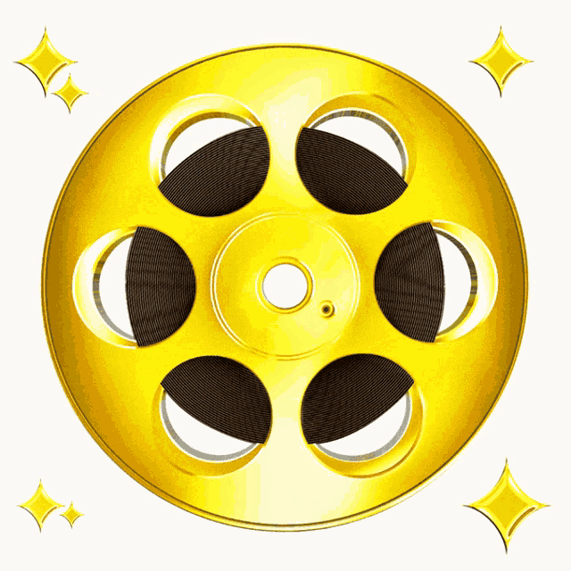 a close up of a gold film reel with a hole in the middle